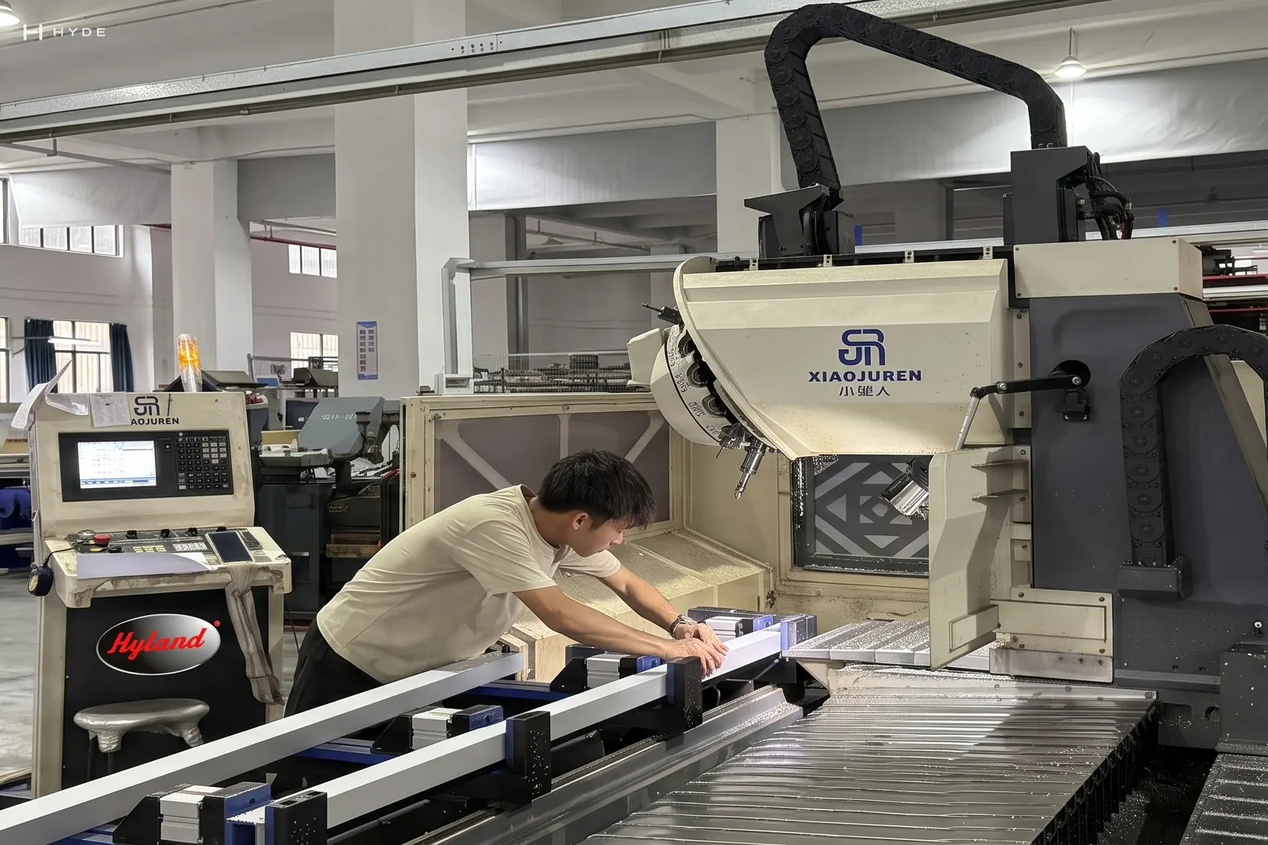 An operator at a CNC machine on our shop floor